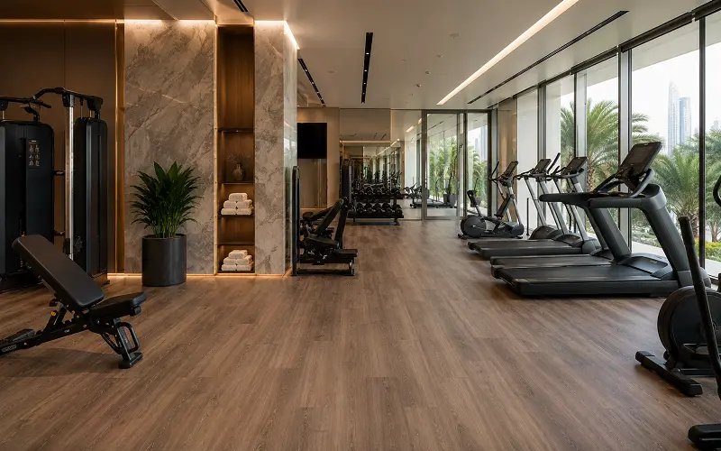 Hotel gym interior with premium LVT reception and Class 34 SPC cardio zone in a Dubai 5-star property