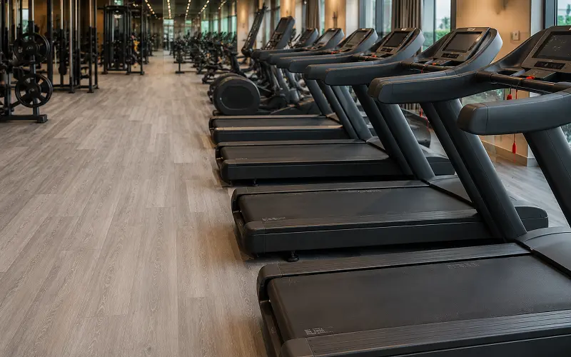 Class 34 wear classification SPC vinyl flooring under cardio equipment in a Dubai commercial gym