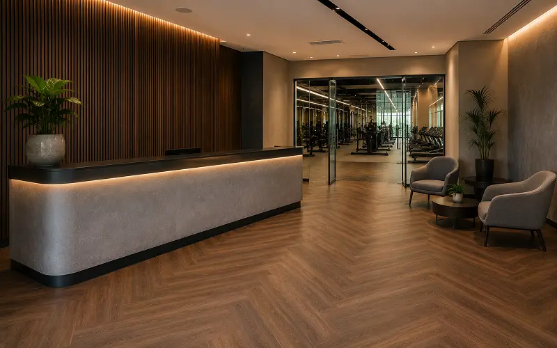Premium LVT vinyl flooring in a Dubai fitness centre reception and sales area