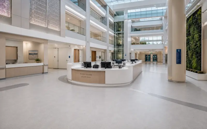 Multi-specialty hospital interior with heat-welded vinyl sheet flooring across patient and surgical zones in Dubai