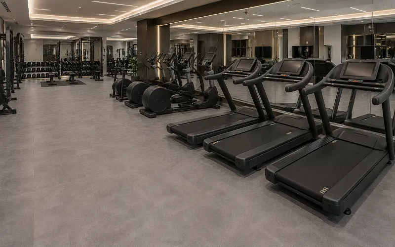 Heavy-duty SPC vinyl flooring in a Dubai hotel gym fitness centre with Class 34 wear classification