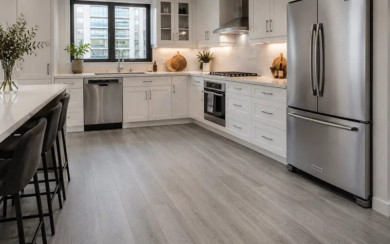 SPC vinyl flooring in a Dubai kitchen with dishwasher and stone-polymer waterproof core