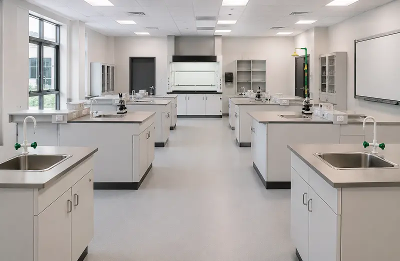 Chemical-resistant heat-welded vinyl sheet flooring in a Dubai school science lab